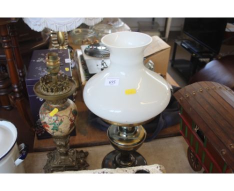 An oriental style table lamp together with an oil lamp with milk glass shade and a candle holder