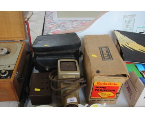 A Kodak projector with original box etc.