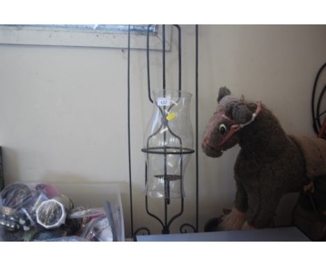 A metal and glass candle lantern 