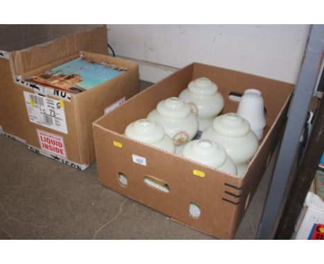 A box containing glass light shades 