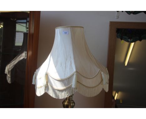 A standard lamp and shade
