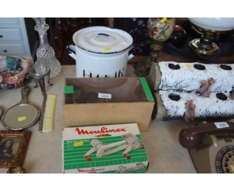 An enamel flour bin together with a mincer and a Molineux mincer