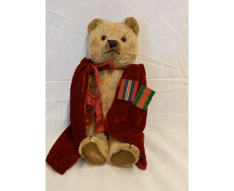 VINTAGE TEDDY BEAR WITH A RED VELVET CLOAK &amp; 2 MEDAL RIBBONS