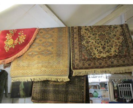 A Turkish runner having a brown background and elephant gull design together with three other rugs. Location: RWM Eaves 