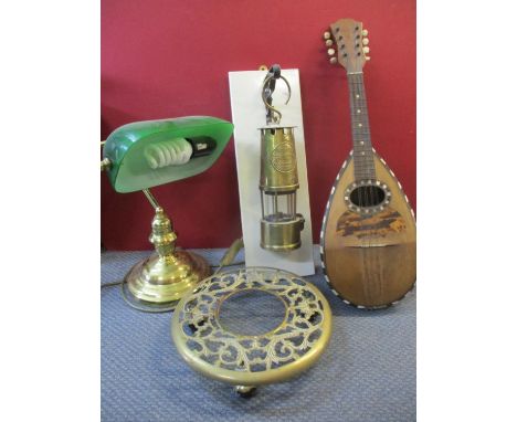 A Pietro Tonelli mandolin, a Lamp &amp; Lighting Co Protector oil lamp on mounted panel, a brass lamp trolley on castors and 