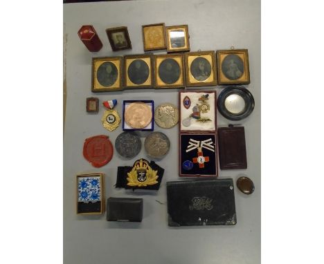 A mixed lot of medals, medallions, ambrotype photographs and other items to include a League of Mercy 1898 enamelled metal in