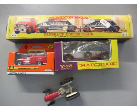 A Matchbox Fruehauf Hopper Train in original box by Lesney together with two later Matchbox vehicles and a vintage Massey-Fer