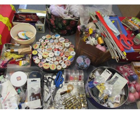 Vintage sewing related items to include DMC threads, wooden cotton reels such as Sylko and Coats, knitting needles, scissors,