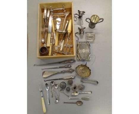 A selection of silver and silver plated items to include a silver twin handled trophy cup, three silver handled button hooks 