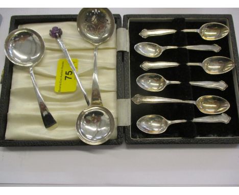 A 20th century silver tea strainer and matching caddy spoon, together with a Chinese silver spoon with carved amethyst buddha