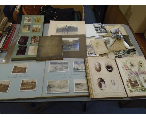 A collection of Victorian, Edwardian and later family photographs to include a Victorian family portrait album, an Edwardian 