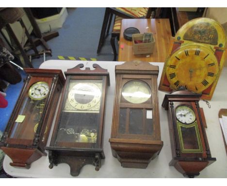 Four 20th century wall clocks, together with a Grandfather clock movement 