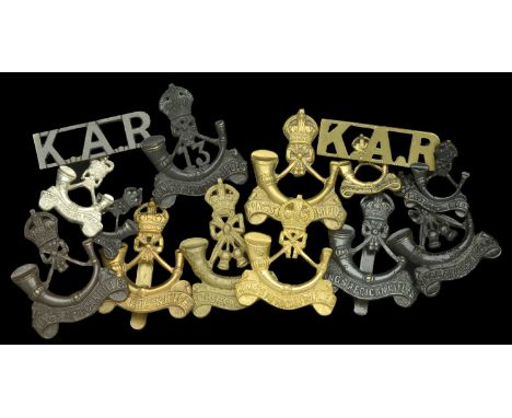 King’s African Rifles Insignia. A selection of insignia including, cap badges Officers gilt another Bronze example and collar