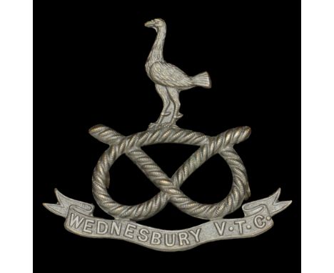 Wednesbury Volunteer Training Corps Cap Badge. A scarce Cap Badge c.1914-19, bronze Peacock on Staffordshire Knot, title scro
