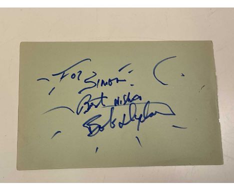 BOB DYLAN; a page from an autograph book bearing the megastar's signature and inscribed 'For Simon, Best Wishes', with furthe