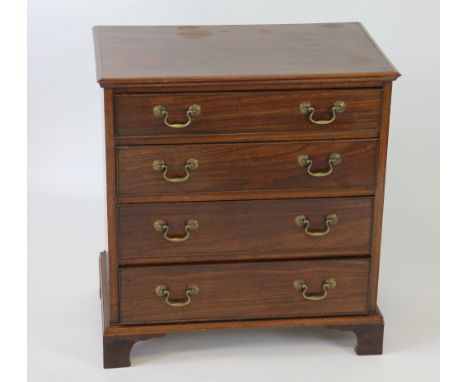 A George III style mahogany chest of small proportions, with four graduated long drawers, on bracket feet, 68cm H x 63cm W x 