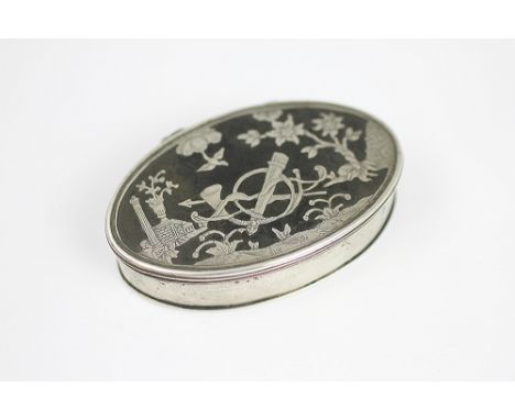 A mid 18th century century silver and tortoiseshell oval snuff box, the top decorated with trophies within a landscape, 7.5cm