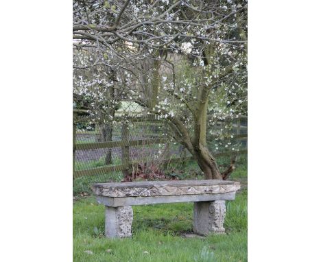 A reconstituted stone garden bench, with acanthus scroll end supports, (as found), 54cm H x 138cm W x 45cm D, with a garden t