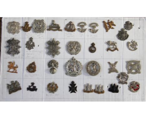 A collection of British Army badges, to include; Liverpoorl Scottish, Cameron Highlanders etc, together with some Colonial ba