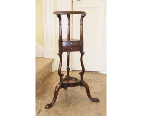 A George III mahogany wig stand, with two drawers and under-tier, on tripod base and pad feet, 79cm H