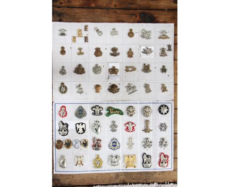 A collection of British Army badges, to include; Royal Irish Fusiliers, Cheshire and Lanarkshire Yeomanry (Qty on 4 boards) 