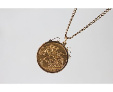 A George V gold sovereign, 1912, in 9ct gold mount and yellow metal chain