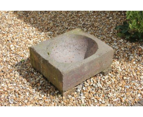 A reconstituted stone garden trough, with dished centre 20cm H x 56cm W x 47cm D, with an ammonite fragment (2)