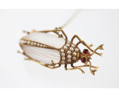 A Victorian insect brooch, possibly a Stag Beetle, with carved moonstone body, seed pearl set and with garnet set eyes, all s