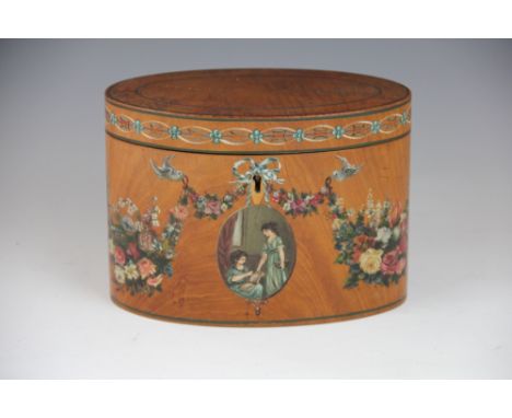 A painted satinwood tea caddy, the oval caddy with painted garlands, swags and oval portrait of two young lady's, foil lined 