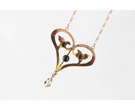 An Art Nouveau garnet and mother of pearl set pendant, the pendant of heart shaped, set with three garnets and with a pear sh