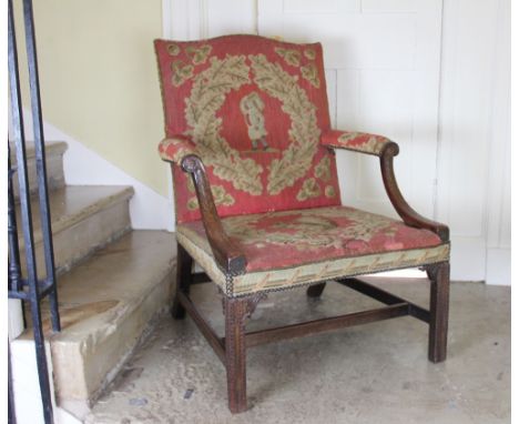 A George III carved mahogany Gainsborough chair, the back, seat and arms with red ground tapestry upholstery depicting a male