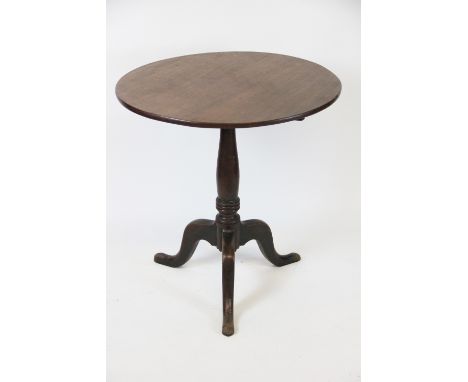 A George III mahogany tile top occasional table, with one piece circular top, on a turned column and tripod base, 72cm H x 69