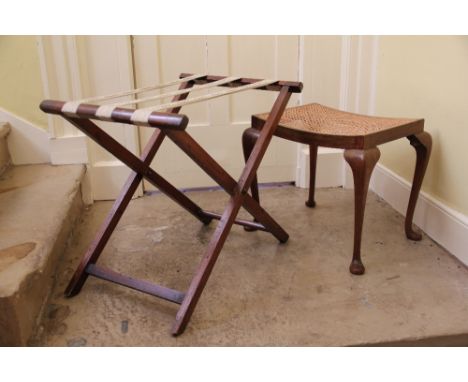 A luggage rack on folding stand and a caned seat stool on cabriole legs (2)