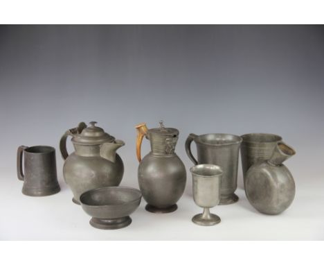 A collection of 19th century pewter, to include a Quart mug 16cm, a baluster drinks vessel, a mask spout ewer with bone handl