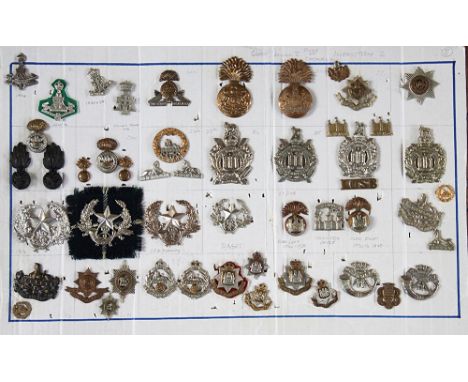A collection of British Army badges, to include; Welsh, Dorset and South Staffordshire  Regiments etc (approx 87 on 2 boards)