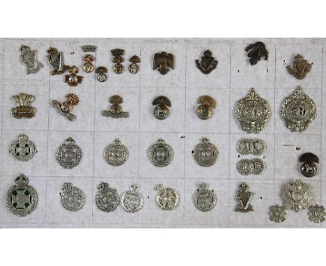 A collection of British Army badges, to include; The Royal Scotts, The Royal Dublin Fussiliers, Lincolnshire Regiments etc (a