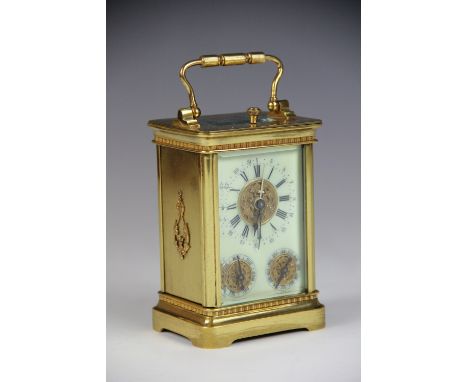A late 19th century French lacquered brass eight day carriage calendar time piece, the enamel dial with Roman numeral chapter