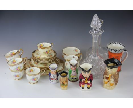 A Royal Albert twenty one piece part tea set, decorated with floral sprigs, a Royal Doulton jug decorated with hieroglyphs, a