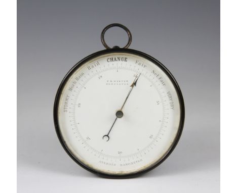 A brass aneroid barometer, the enamel dial signed T. B. Winter Newcastle, 23.5cm