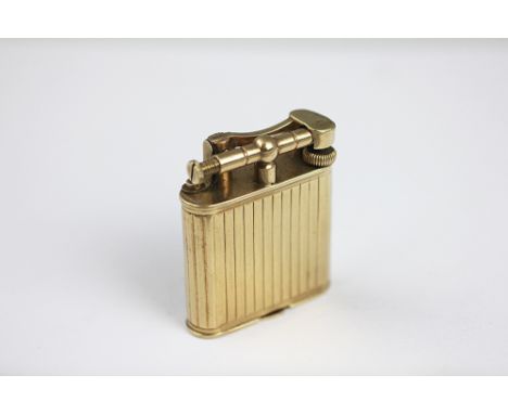 A 9ct gold Dunhill cigarette lighter, Pat No 392107, with fluted detailing, 52.6gms gross