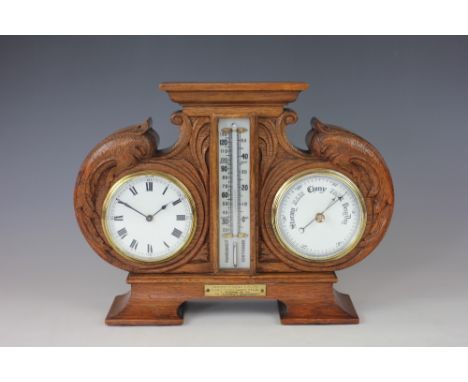 A late Victorian carved golden oak combination timepiece, barometer and thermometer, with presentation plaque to Captain E. W