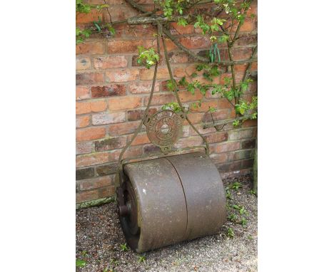 A cast iron 'The Alexandra' lawn roller by Dicksons of Chester barrel 50cm, and a cast iron mangle (2)