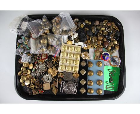 A collection of Army and Navy badges and buttons, with an un-attributed WWII pair, a Navy white metal belt buckle and a Stude