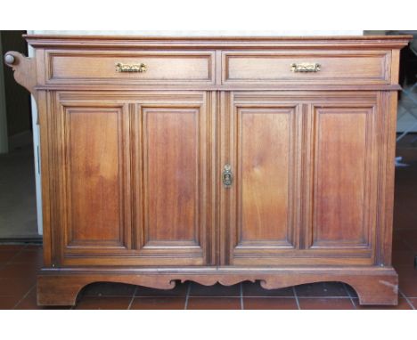 An Edwardian Howard and Sons walnut cabinet, with two drawers and two cupboard doors on bracket feet, stamped to the drawer, 