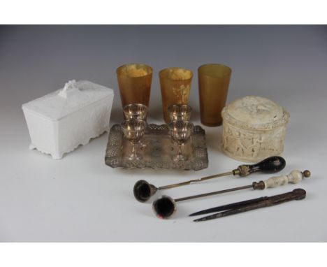 A pressed glass tea caddy, the milk glass caddy with ivy leaf detail, 18cm wide, along with an EPNS egg cup stand, candle snu