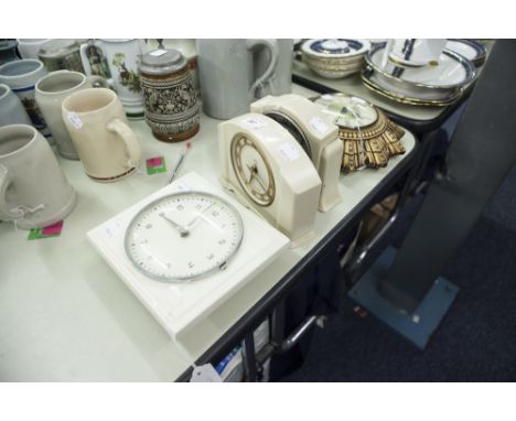 TWO, CIRCA 1940s, SMITHS CREAM PLASTIC CASED MANTEL CLOCKS, A SMITHS GILT COMPOSITION SUN-BURST WALL CLOCK AND A 1950s KIENZL