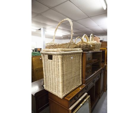 A WICKER LINEN BASKET AND COVER, AN OBLONG GILT FRAMED WALL MIRROR, ANOTHER MIRROR AND A QUANTITY OF BASKETS 