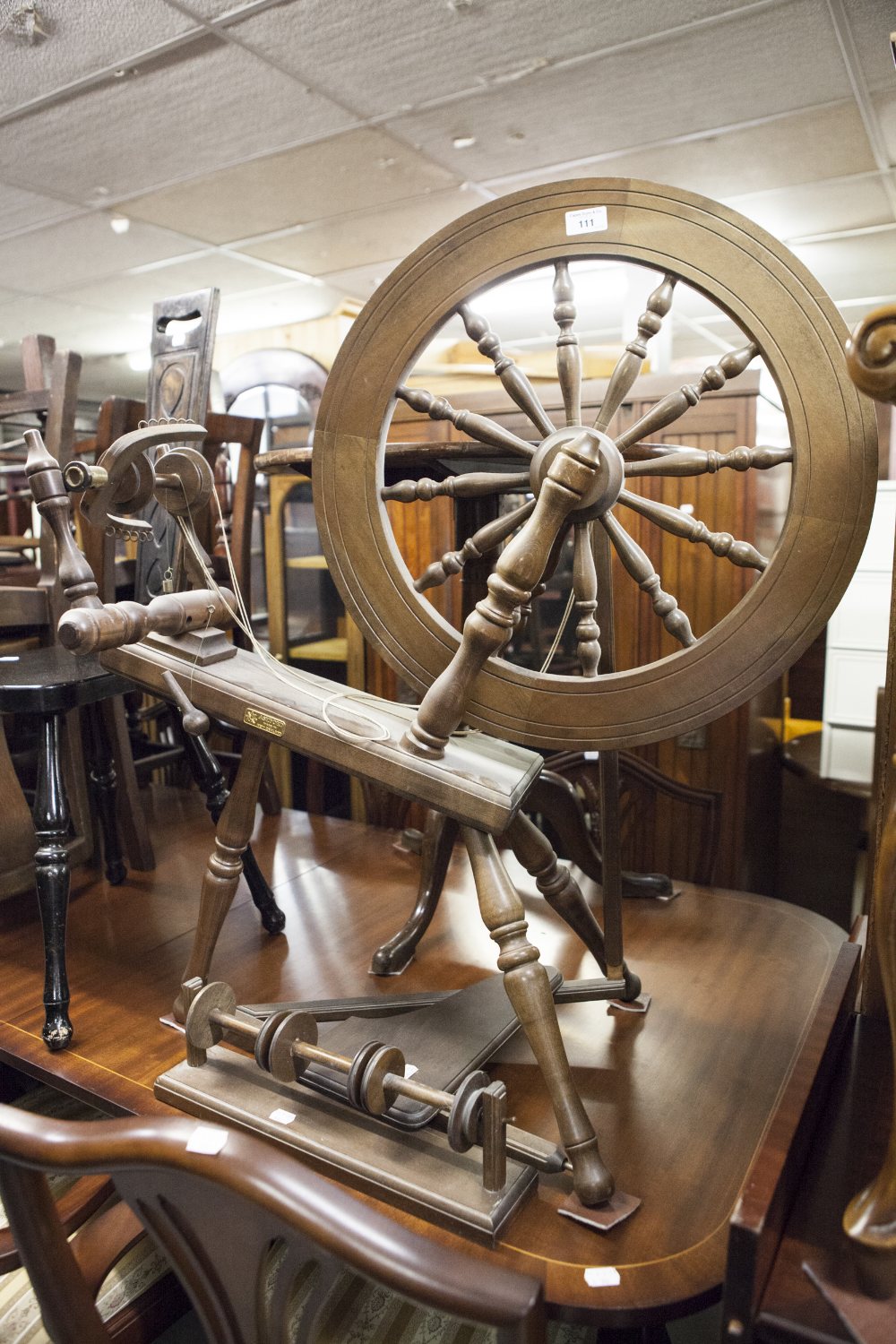 A BEECH SPINNING WHEEL, BY ASHFORD, MADE IN NEW ZEALAND, WITH PLAQUE