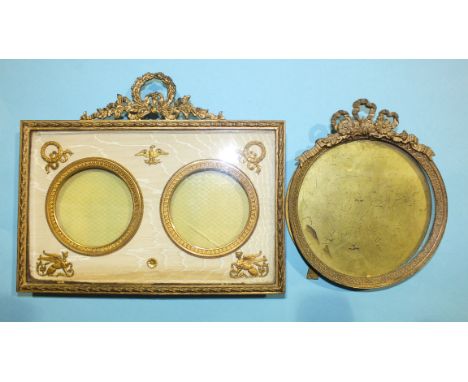 A 20th century gilt metal double-portrait miniature frame, 17 x 19.5cm overall, apertures 6cm diameter and a gilt metal circu