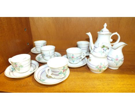 A Continental porcelain dolls tea service, (one saucer damaged).